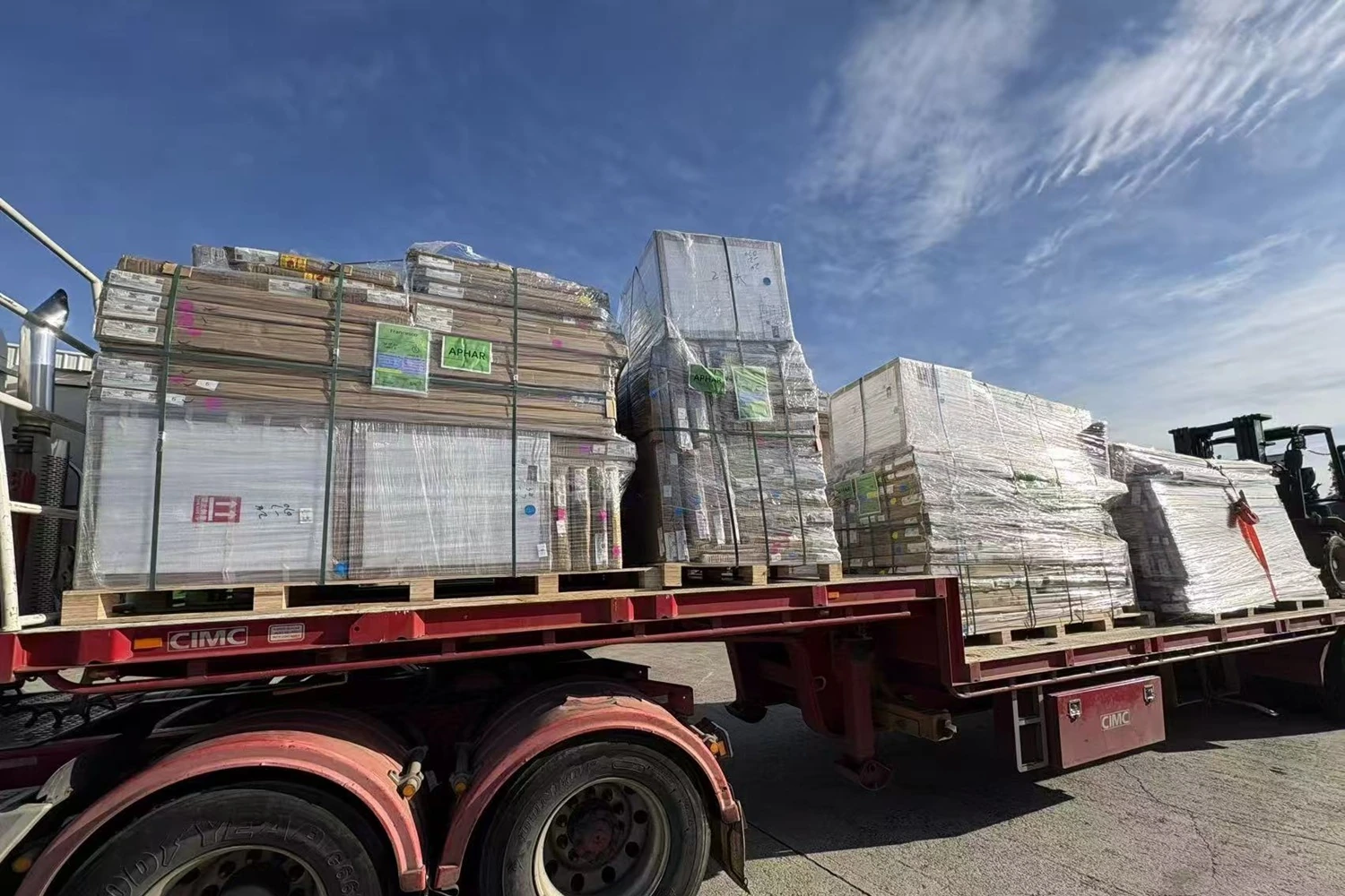 Wrapped and strapped cargo secured on pallets on a flatbed truck