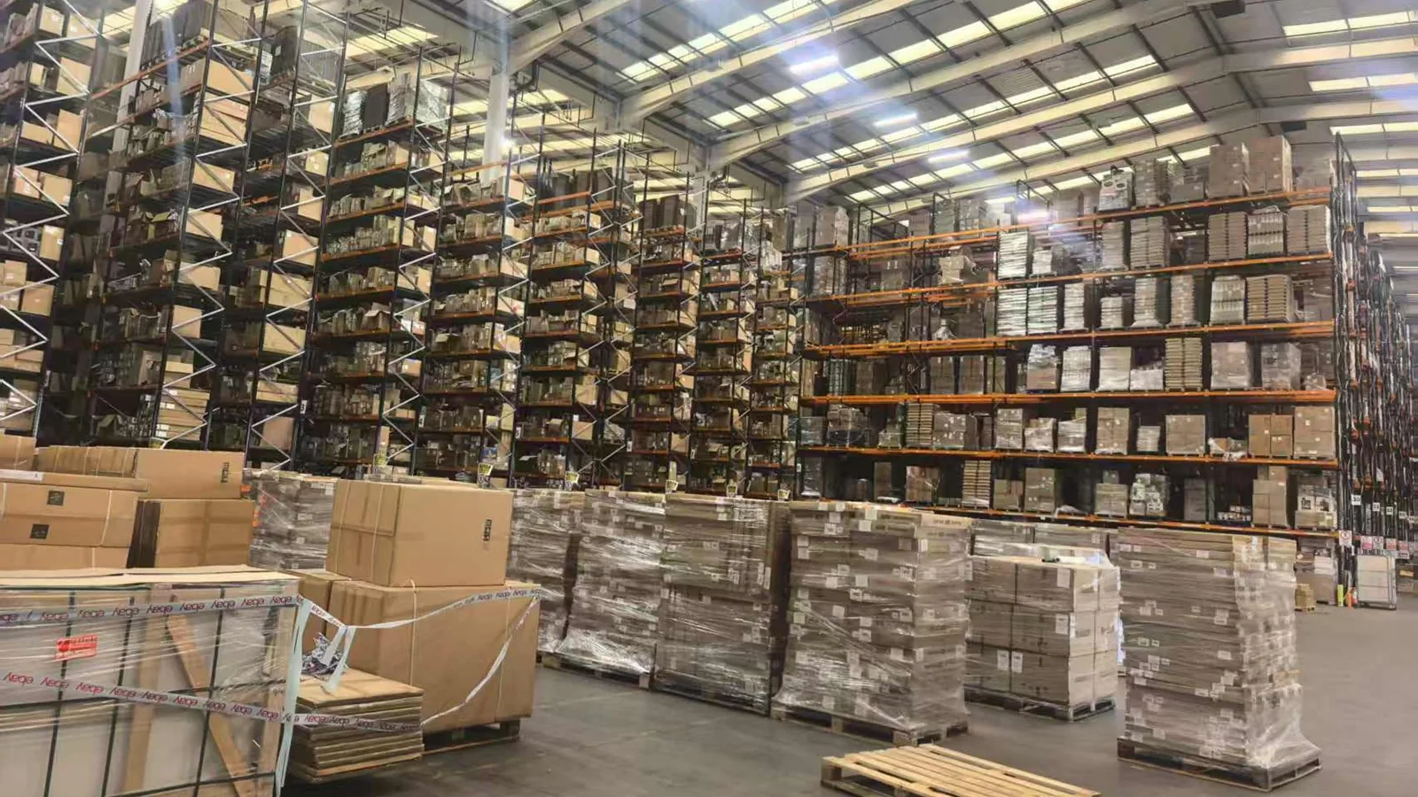 Modern Australian 3PL warehouse with pallet racking, cartons and forklift operations